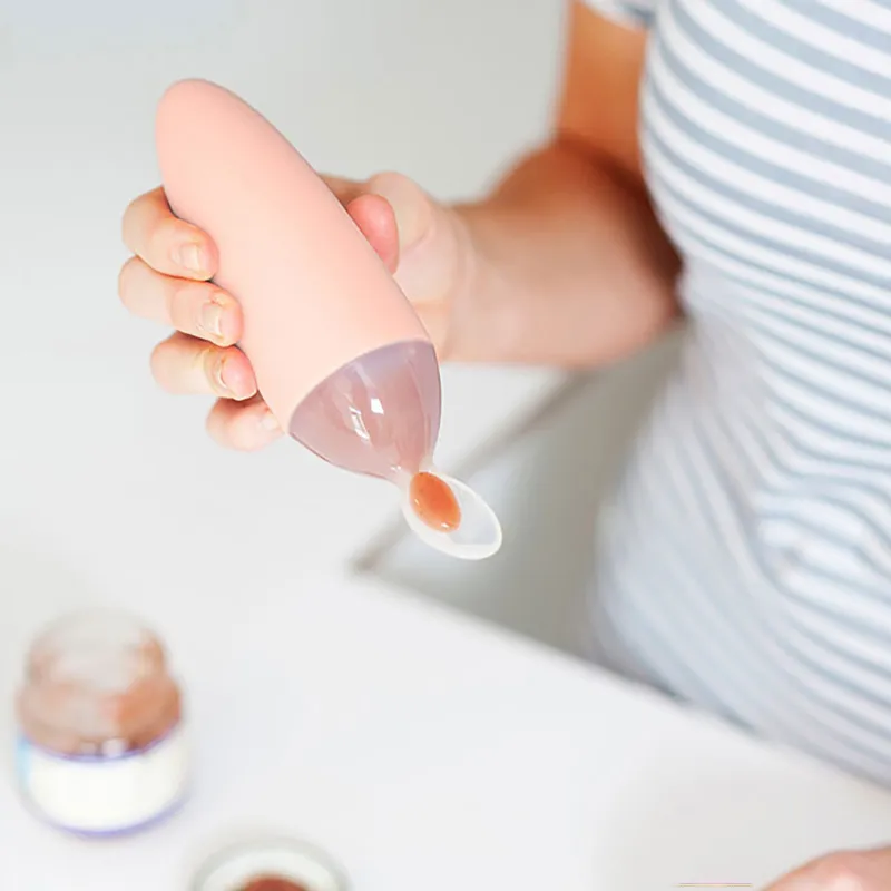 Cuillère distributrice d'aliments Squirt Rose - 4m+-2